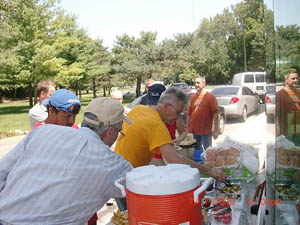 Any worker who spent calories in the morning got them replenished twice over by Miles Krivena who both purchased and prepared the mid day sustenance. Most of us couldn’t make a choice so we each had a burger, and a brat and a polish or two with fresh cherries, blueberries and strawberries followed by cup cakes from Whole Foods. 